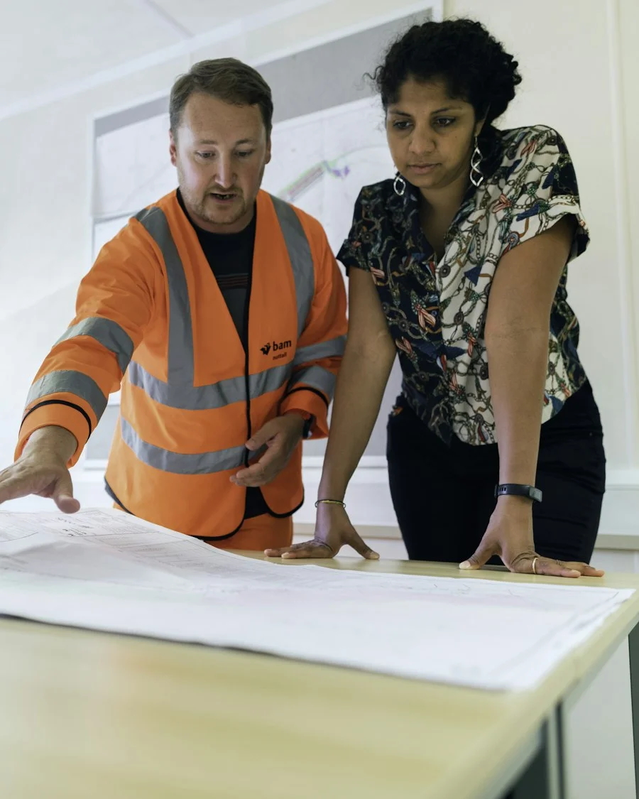 Site engineer and consultant reviewing plans for a connected deployment