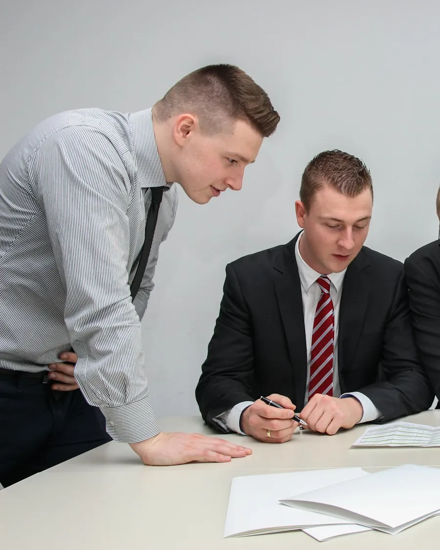 Consultants reviewing project scope documents at a desk