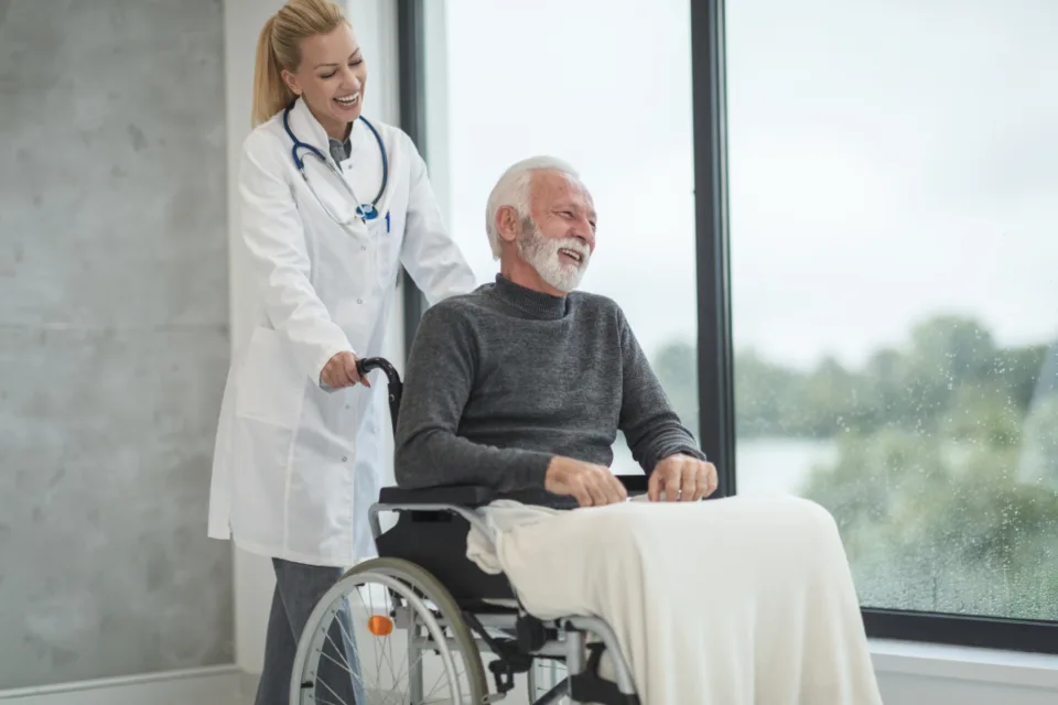 Doctor walking with a patient in a hospital